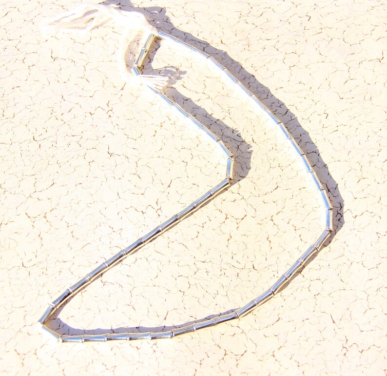 M-068 Dog Bone Shaped Silver Plated over Brass Beads