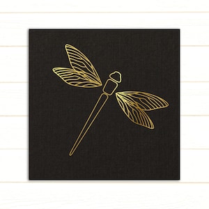 May include: A gold dragonfly silhouette on a black background. The dragonfly is outlined in gold and has delicate wings.