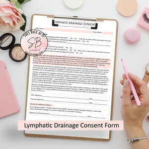 May include: A white lymphatic drainage consent form with a pink pen on a white surface. The form has the title "Lymphatic Drainage Consent" and includes sections for client information, consent to treatment, and consent for treatment of a minor.