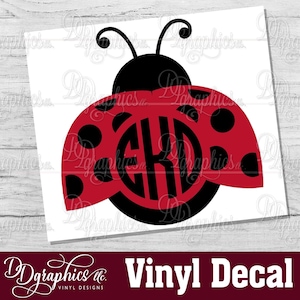 May include: Red and black ladybug vinyl decal with a monogram in the center. The monogram is the letters "EKD".