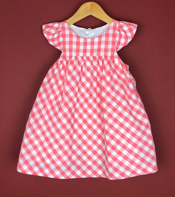 The "Flutter-By Dress" in Salmon Gingham.