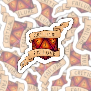 May include: A die-cut sticker featuring a twenty-sided die in shades of red and orange, displaying the number one. A tan-colored ribbon banner wraps around the die with the text CRITICAL FAILURE printed in black capital letters.