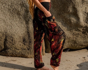 Black yoga trousers with flame coloured peacock feather design, loose harem pants, colourful hippie trousers