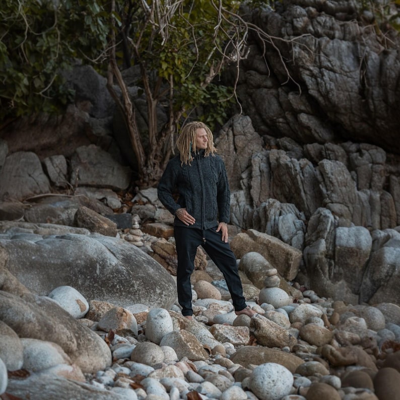 Man wearing a handmade charcoal wool Aran jacket, idea for gardening, hiking or staying cosy outdoors