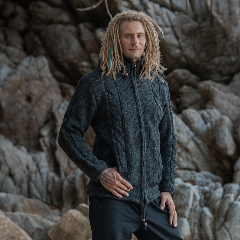 Close-up pf grey Aran jacket with removeable hood and zipped pockets - perfect for nights by the fire and outdoor winter activities