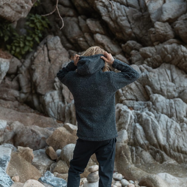 Back view of charcoal grey Aran knit jacket with detachable hood, cosy fit for outdoor lovers and nature walks - perfect gift for  gardeners, golfers, equestrians and fishermen