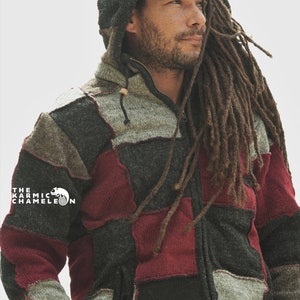 May include: A patchwork hooded jacket in shades of gray, black, and burgundy. The jacket features a zipper closure, a drawstring hood, and a small pocket. The Karmic Chameleon logo is visible on the left side.