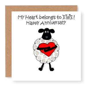 May include: A white sheep with black eyes and legs holds a red heart in its arms. The text "MY HEART BELONGS TO EWE! Happy Anniversary" is written above the sheep.