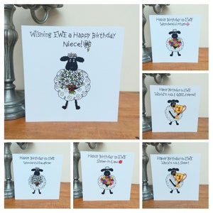 May include: A set of six greeting cards featuring a black sheep holding flowers or a trophy. Each card has a different message, such as "Happy Birthday to EWE Wonderful Mum" or "Happy Birthday to EWE World's No.1 Sister!"