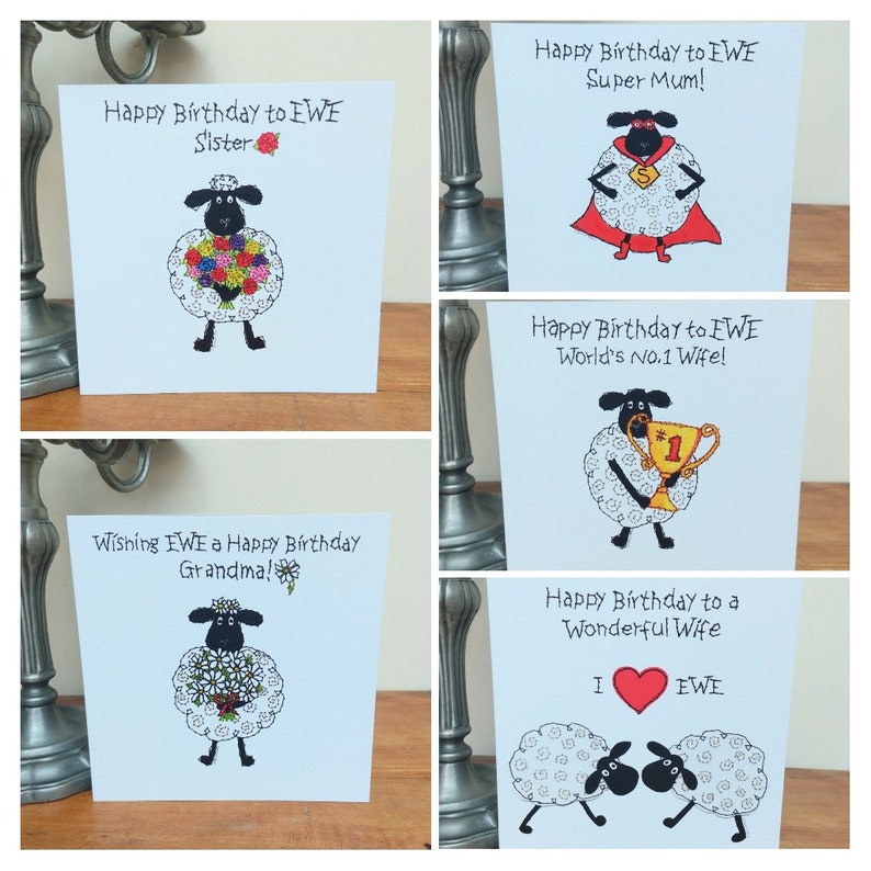 May include: Set of four greeting cards featuring a cartoon sheep with different messages. The cards say "Happy Birthday to EWE Sister", "Happy Birthday to EWE Super Mum!", "Happy Birthday to EWE World's No.1 Wife!" and "Happy Birthday to a Wonderful Wife I love EWE".