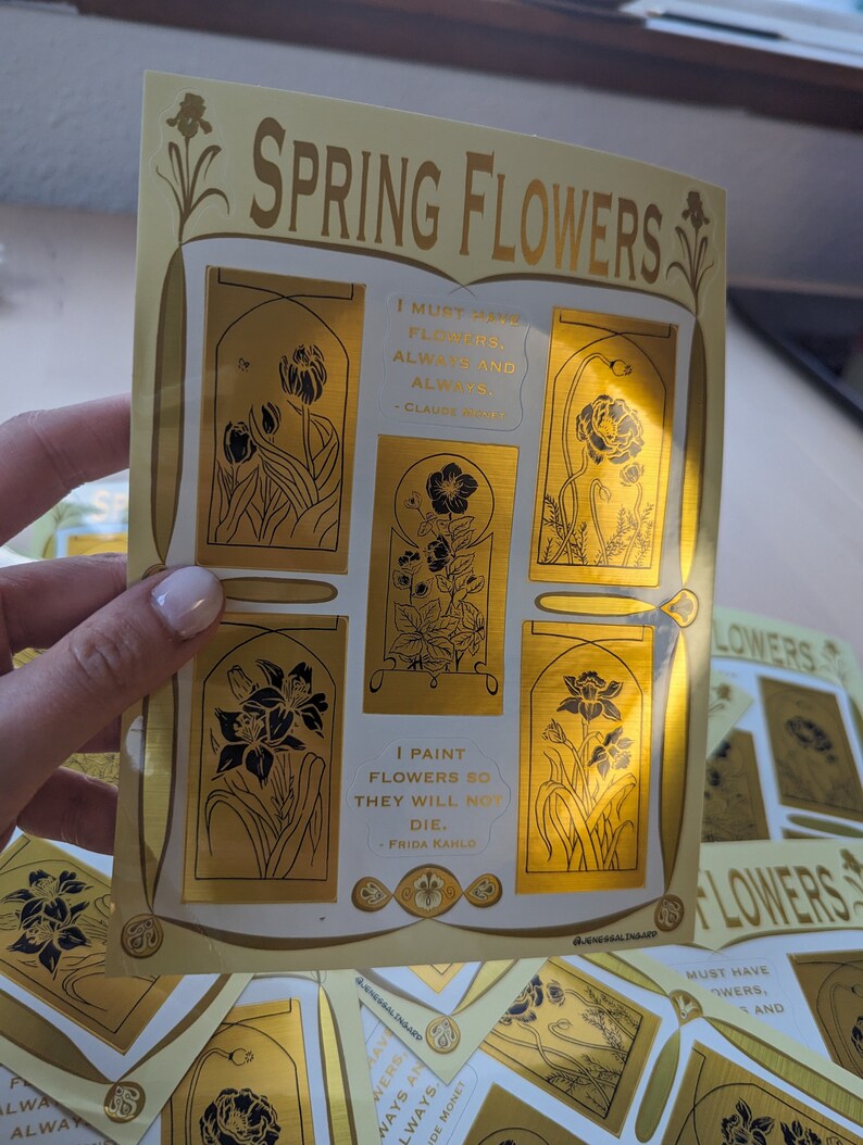 May include: A set of gold foil stickers featuring different spring flowers and quotes about flowers. The stickers are on a white background and have a gold border. The quotes include "I must have flowers, always and always." - Claude Monet and "I paint flowers so they will not die." - Frida Kahlo.