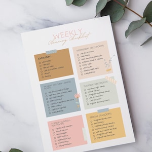 May include: A printable weekly cleaning checklist with a different color for each day of the week. The checklist includes tasks for the bathroom, bedroom, kitchen, dining room, living room, playroom, and random tasks.