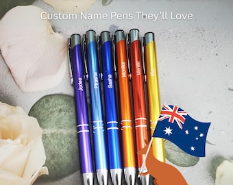 May include: Six retractable ballpoint pens in purple, light blue, dark blue, orange, red, and yellow, each featuring a silver clip and a personalized name printed in white. The text reads Gifts from Teacher to Student Custom Name Pens They'll Love.