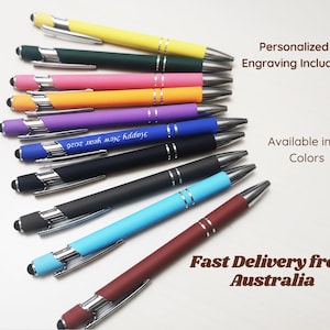 May include: A collection of colourful pens with silver detailing. The pens come in a range of colours, such as yellow, green, pink, orange, purple, blue, black, and burgundy. The blue pen has the text "Happy New Year 2026". The image also includes the text "Personalized Engraving Included" and "Available in 10 Colors".