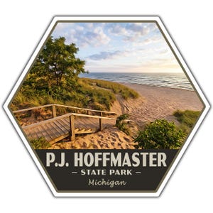 May include: A hexagonal sticker featuring a scenic view of a sandy beach with a wooden staircase leading down to the shore, green dune grass, and a sunset sky. The bottom section is dark brown with the text P.J. HOFFMASTER - STATE PARK - Michigan.