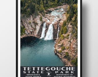 May include: A framed vertical poster featuring an aerial view of a waterfall cascading into a dark blue pool surrounded by rocky cliffs and green pine trees. The bottom text reads TETTEGOUCHE STATE PARK, MINNESOTA STATE PARKS, DEPARTMENT OF NATURAL RESOURCES.