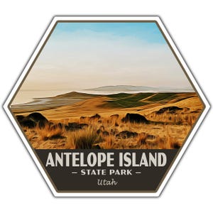May include: A hexagonal sticker featuring a landscape of Antelope Island State Park in Utah. The image shows golden-brown hills, a lake, and a blue sky. The text "ANTELOPE ISLAND - STATE PARK - Utah" is displayed at the bottom.