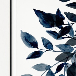 May include: A watercolor painting of a branch with blue leaves on a white background. The leaves are painted in a loose, abstract style, giving the painting a modern and minimalist feel.