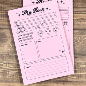 May include: Pink printable book review tracker with sections for title, author, genre, mood, start/finish date, page count, overall rating, plot rating, spicy rating, characters, notes, and quotes.