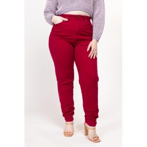 May include: High-waisted, red denim jeans with a straight leg fit.
