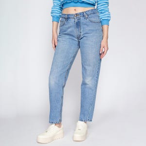 May include: Light blue denim jeans with a high waist and a straight leg fit.