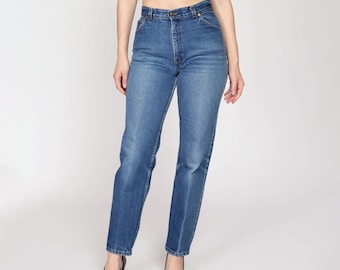 Medium 80s Levis White Tab High Waisted Jeans 28" | Vintage Levi's Medium Wash Denim Tapered Leg Mom Jeans
