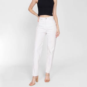 May include: White high-waisted straight leg jeans with a relaxed fit.