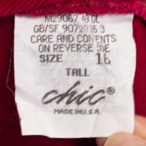 May include: White tag with black text that reads "M29067 49 GL", "GB/SF 90720 25 3", "CARE AND CONTENTS ON REVERSE SIDE", "SIZE 16 TALL", "chic&reg;", and "MADE IN U.S.A."