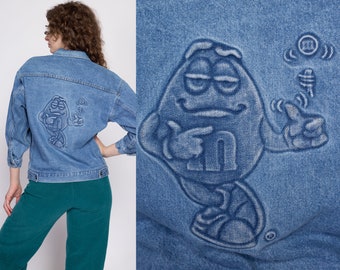 90s M&Ms Embossed Denim Jacket Petite Small to Medium | Vintage Candy Brand Logo Coin Toss Graphic Medium Wash Jean Jacket