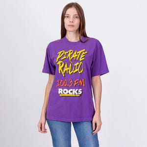 Medium 90s Pirate Radio 100.3 FM Rocks T Shirt Unisex | Vintage Los Angeles Radio KQLZ Collectible Graphic Tee