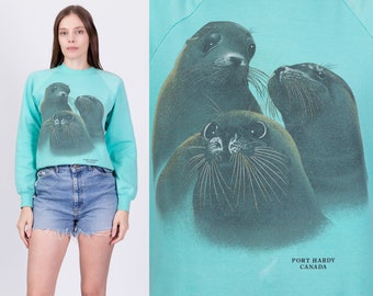 Medium 80s Sea Lion Sweatshirt | Vintage Port Hardy Canada Aqua Blue Raglan Sleeve Tourist Crewneck Pullover