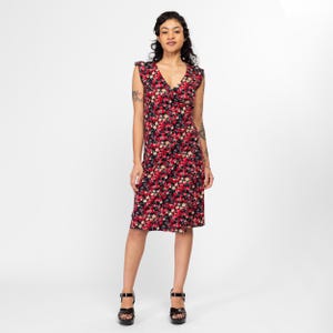 May include: A sleeveless midi dress with a V-neckline and a floral print in shades of red, pink, and yellow on a black background. The dress has a fitted bodice and a slightly flared skirt.