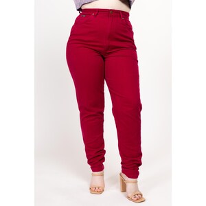 May include: High-waisted, red denim jeans with a straight leg fit.