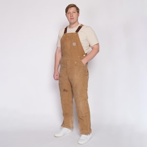 90s Carhartt Insulated Quilt Lined Distressed Overalls - 38x34 | Vintage Made In USA Tan Workwear Jumpsuit