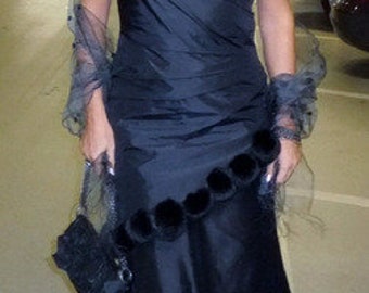 black evening dress with canine fur bobbles