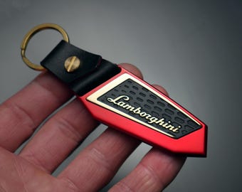 Brelok Lamborghini, anodowane aluminium, złoto, mosiądz, skóra, Urus, Aventador, Huracan, murcielago, Gallardo, czerwony