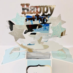 Carta aeroplano in una scatola/scatola pop-up