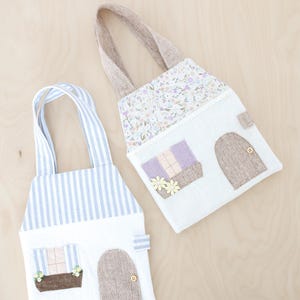 Peut inclure: Ensemble de trois mugs en céramique avec une finition mate et mouchetée. Les tasses sont de couleur crème, gris clair et gris foncé. Chaque mug a un design simple et minimaliste avec une anse arrondie.