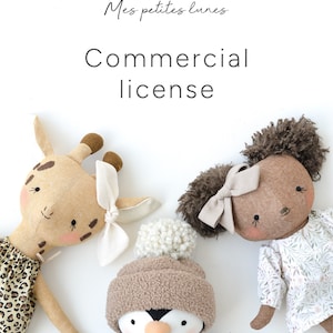 May include: Three handmade plush toys: a giraffe wearing a leopard print dress, a penguin wearing a brown hat with a white pom-pom, and a brown-skinned doll with brown hair wearing a white dress with floral print. The text "Mes petites lunes Commercial license" is written above the toys.