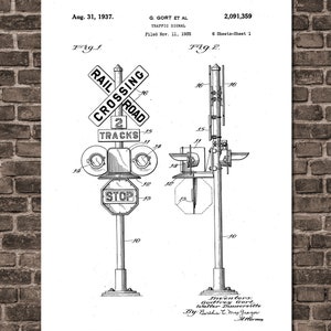 May include: Black and white line drawing of a patent for a traffic signal. The drawing shows a railroad crossing sign with the words "Rail Crossing Road" and "2 Tracks". There is also a stop sign and a traffic light.