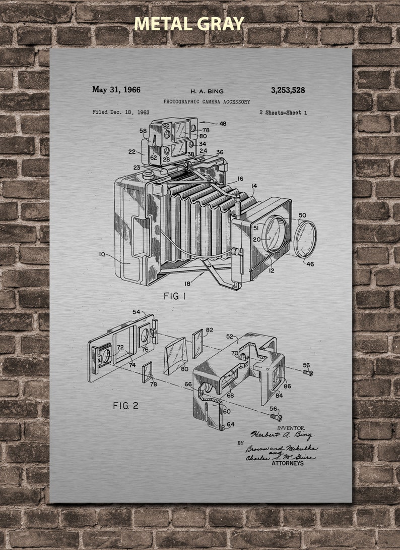 May include: A black and white line drawing of a photographic camera accessory patent. The patent is titled "Photographic Camera Accessory" and was filed on December 18, 1963, by Herbert A. Bing. The patent number is 3,253,528. The drawing shows a detailed view of the camera accessory.