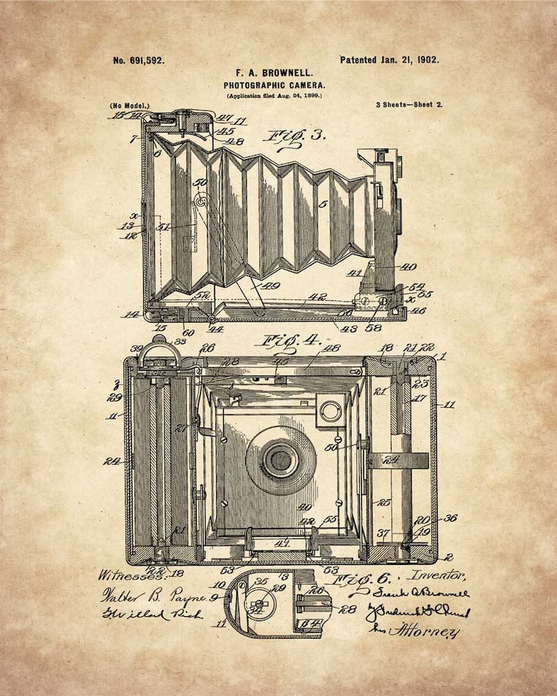 May include: A black and white line drawing of a photographic camera patent from 1902. The patent is for a folding camera with a bellows system. The drawing shows the camera in both its folded and extended positions. The patent number is 691,592 and the inventor is F. A. Brownell.