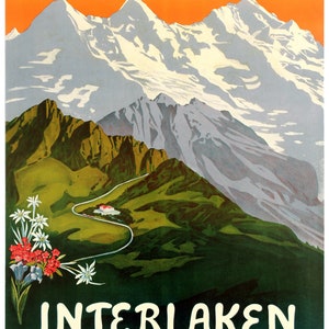 May include: Vintage travel poster advertising the Schynige Platte Bahn in Interlaken, Switzerland. The poster features a scenic mountain landscape with snow-capped peaks, green hills, and a winding road. The text "Schynige Platte Bahn" is at the top of the poster, and "Interlaken" is at the bottom, with "Schweiz - Suisse Switzerland" below that.