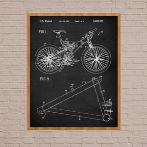 May include: Black and white line drawing of a bicycle patent, showing the design of a mountain bike. The patent number is 5,685,553 and the date is Nov. 11, 1997. The drawing shows the bike's frame, wheels, and suspension system.