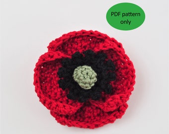 May include: A crocheted red poppy flower with a black and green center.  PDF pattern only.