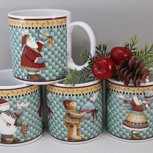 May include: A white ceramic mug featuring a green and white checkered pattern, a yellow border with small red berries, and illustrations of a Santa Claus, a snowman, and a teddy bear holding globes, with a white handle and a smooth finish.