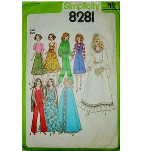 May include: A Simplicity 8281 sewing pattern envelope featuring illustrations of various outfits including a wedding dress with a veil, a jumpsuit, a cape, and several dresses with floral and solid patterns, all displayed on a light green background.