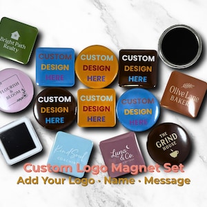 May include: A collection of custom logo magnets in various shapes and colors. Some magnets feature text like "Bright Path Realty", "Flourish & Bloom", and "Olive Lane Baker". Other magnets have "Custom Design Here" text. The set includes a black round magnet.