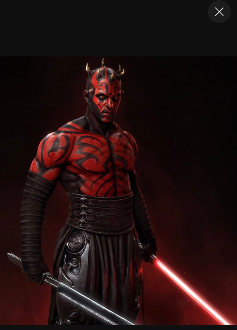 May include: A red and black figure with horns and a red lightsaber. The figure is wearing a black outfit with a red and black pattern.