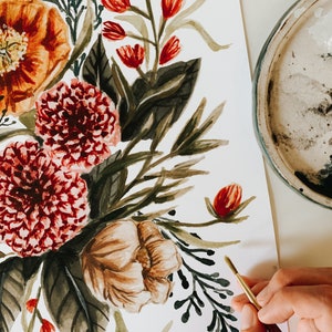 May include: A watercolour painting of a floral bouquet featuring red, orange, and white flowers. The bouquet is painted on a white background and includes green leaves and stems.